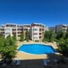 Spacious apartment complex in Sunny Beach with pool and lush gardens.
