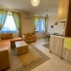 Bright living space with comfortable seating and natural light.