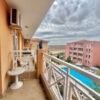 Balcony view of the pool and surrounding apartments from a 30 sq.m. studio in Sunny Day 6.
