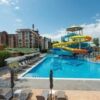 Water park with colorful slides and pool at Tarsis complex, Sunny Beach.