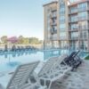 Sunny Beach apartment with pool and outdoor lounging area.