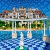 View of Poseidon apartment complex with pool and ornate gazebo in Nessebar.