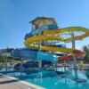 Colorful water slides and pool area for family fun and relaxation.