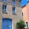 A picturesque village house featuring a courtyard, garage, and terraces, ideal for a charming renova.