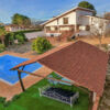 Beautiful villa in Huetor-Tajar featuring a private swimming pool and lush garden. Perfect for comfo.