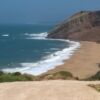 Scenic view of a sandy beach and cliffs in S. Martinho do Porto, Portugal.
