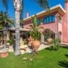 Elegant villa for sale in Quartu Sant'Elena with lush gardens and Mediterranean style.