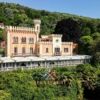 Beautiful historic residence on Lake Maggiore with lush greenery and scenic views.