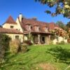 House for sale in Francoules featuring charming architecture, lush garden, and spacious interiors, i.
