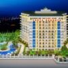 Elegant seaside resort building in Gazipasa with luxurious amenities and lush gardens.