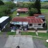 Spacious commercial estate featuring two homes, land, and amenities in Alajuela, Costa Rica. Ideal f.
