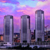 Istanbul skyline with high-rise towers at sunset, showcasing urban development.