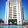 Apartment building in Istanbul with a pool and outdoor seating area.