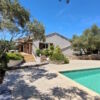 Traditional villa with swimming pool, summer kitchen, and landscaped garden on spacious land.