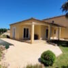 Charming villa with swimming pool, lush garden, and spacious patio in a peaceful location.