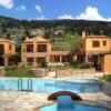 Unfinished stone houses for sale in Likotinara, Crete, with scenic mountain views and private pools.