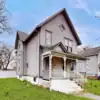 Spacious 5-bedroom home for sale in Crown Point, Indiana, featuring classic architecture and a welco.