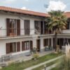 Beautiful villa in Verzuolo Cuneo featuring spacious balconies, lush garden, and Mediterranean-style.