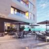 Luxury condos for sale in Tijuana featuring a pool, outdoor lounge, and stunning city views. Perfect.