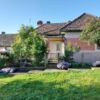 Cozy house in Sārmas with lush garden and colorful flowers, ideal for comfortable living and outdoor.