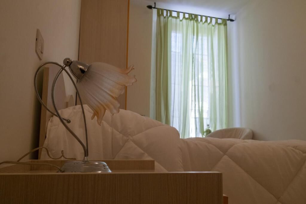 Excellent 5 Bed House for Sale In Sepino Spacious bedroom with natural light and green curtains in a beautiful Sepino home.