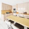 Modern kitchen with beige cabinets and wooden countertops in Orchid Fort, Sunny Beach.