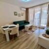 Bright living room with dining area and large loggia, perfect for relaxation.