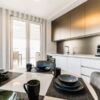Penthouse kitchen with modern design, large terrace, and sunny beach views in Emilia Romana Park. Pa.