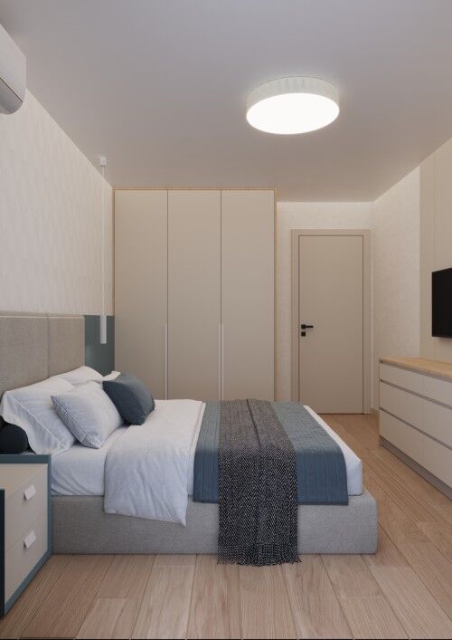 Spacious bedroom featuring contemporary decor, a large bed, and built-in wardrobe in a new Sunny Bea.