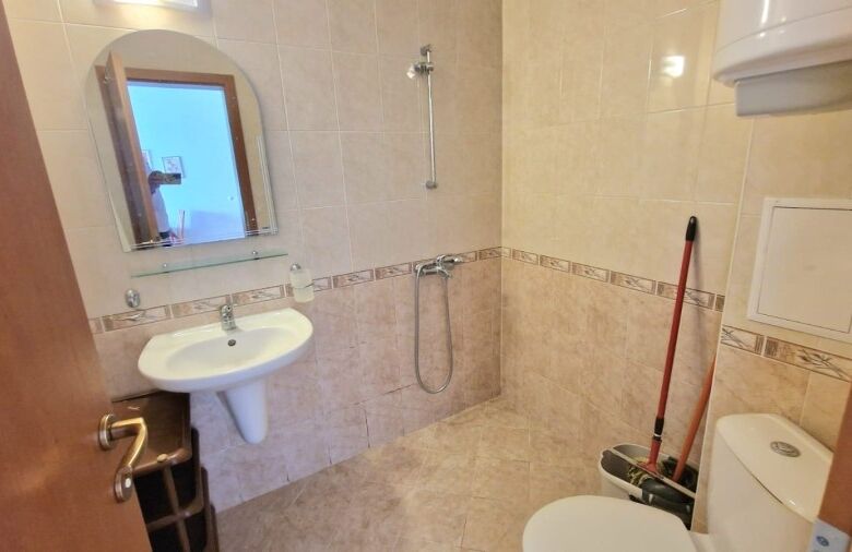 Bathroom with shower, sink, and toilet in Sunny Day 3, Sunny Beach, Bulgaria.