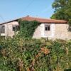 Chantada stone house with traditional architecture, lush greenery, and charming rural setting in Lug.