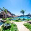 Beautiful luxury 3-bed villa with pool at Coral Beach Resort Flecheiras, featuring tropical gardens.