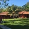 Beautiful Caribbean family legacy property with lush gardens and tropical trees for sale in Trujillo.
