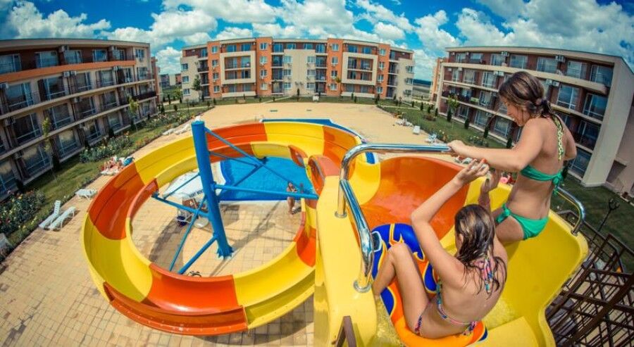 Children enjoying a water slide at Sunny Beach Water Park in Bulgaria.