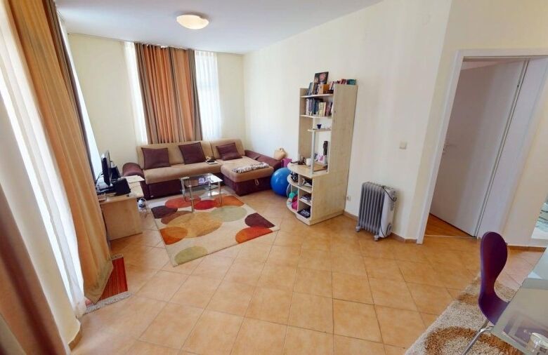 Bright living room with large windows and modern furniture in Barco del Sol.