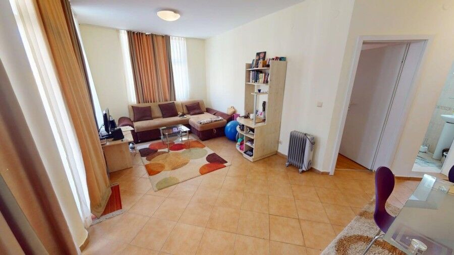 Bright living room with large windows and modern furniture in Barco del Sol.