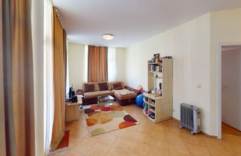 Bright living room with modern furniture and large windows in Barco del Sol.