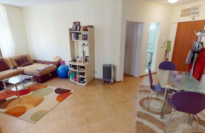 Bright 2-bedroom apartment in Sunny Beach with living area, dining space, and modern furnishings.