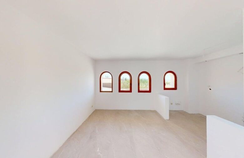 Bright interior of a 1-bedroom ground floor apartment with arched windows in Grand Village, near the.