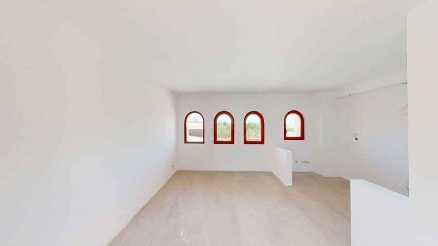 Bright interior of a 1-bedroom ground floor apartment with arched windows in Grand Village, near the.