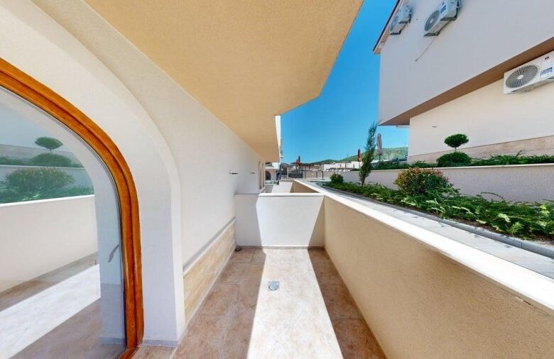 Balcony of a 1-bedroom ground floor apartment in Grand Village, 2 km from the sea.