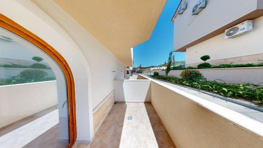Balcony of a 1-bedroom ground floor apartment in Grand Village, 2 km from the sea.