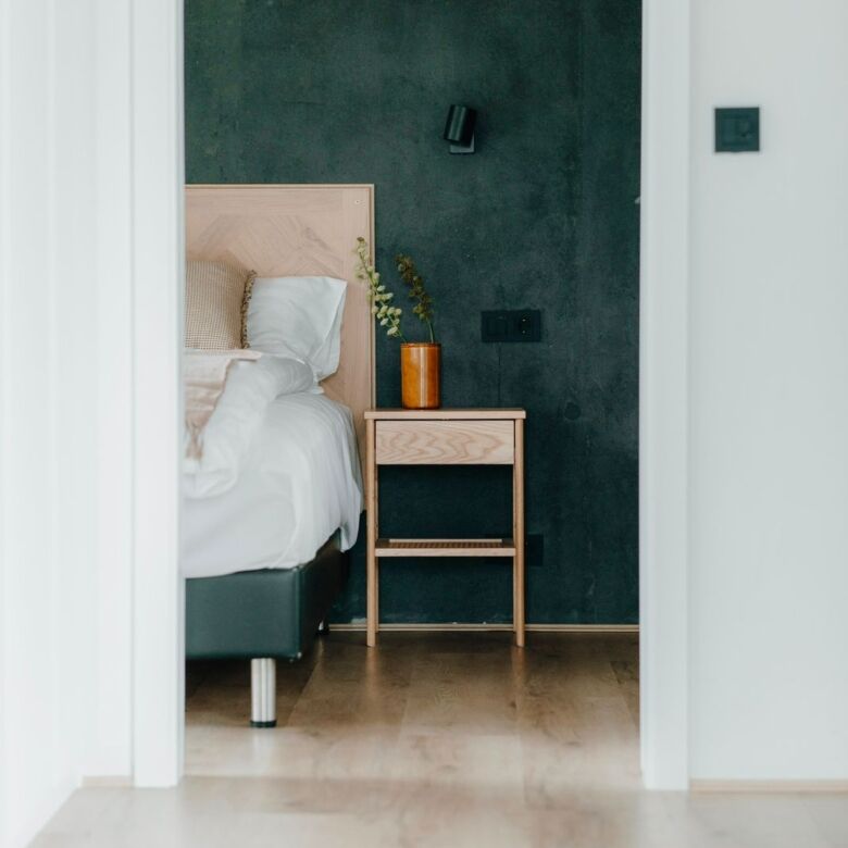 Modern bedroom with stylish decor and natural lighting in Reykjavik.