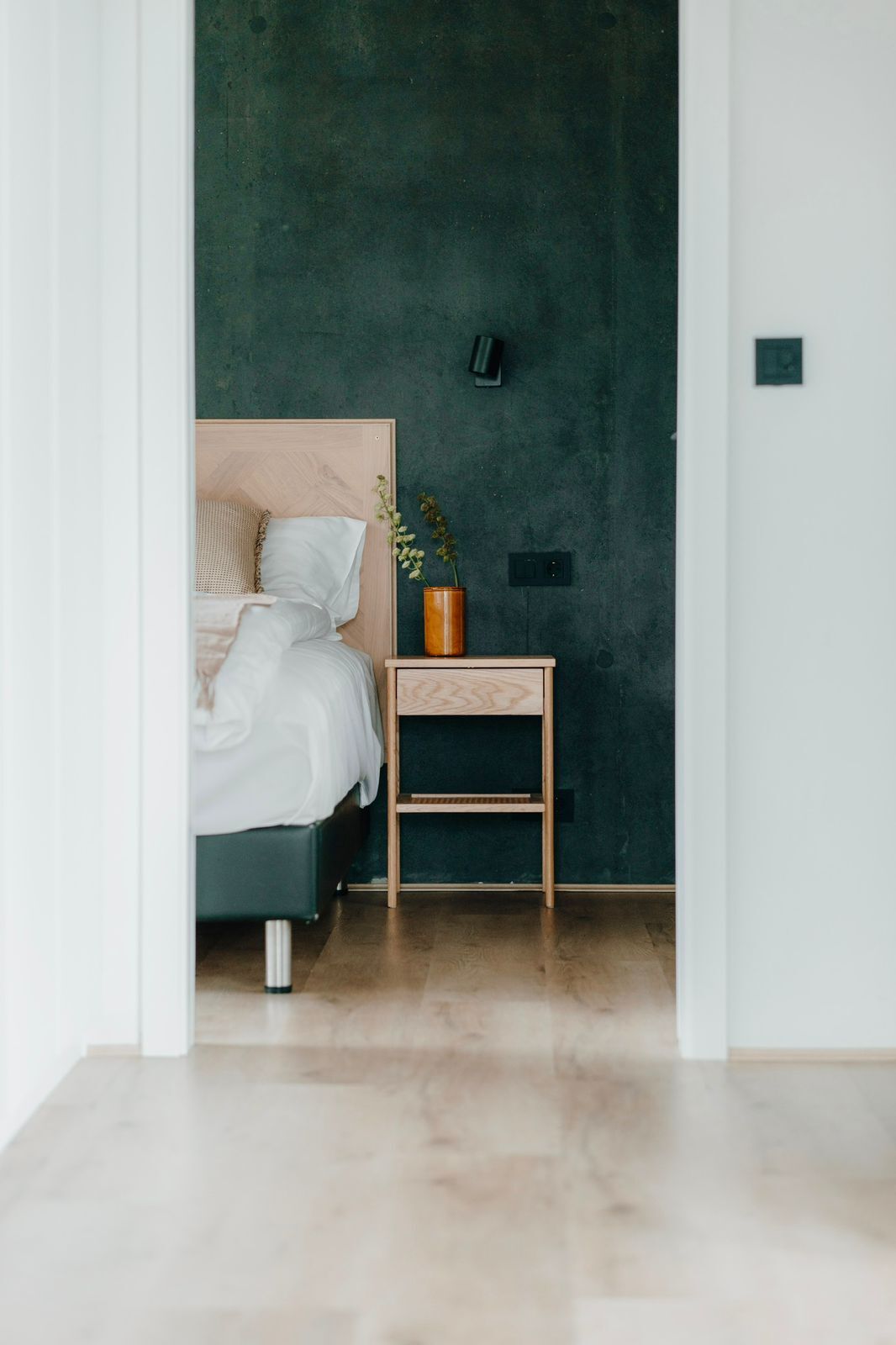 Modern bedroom with stylish decor and natural lighting in Reykjavik.