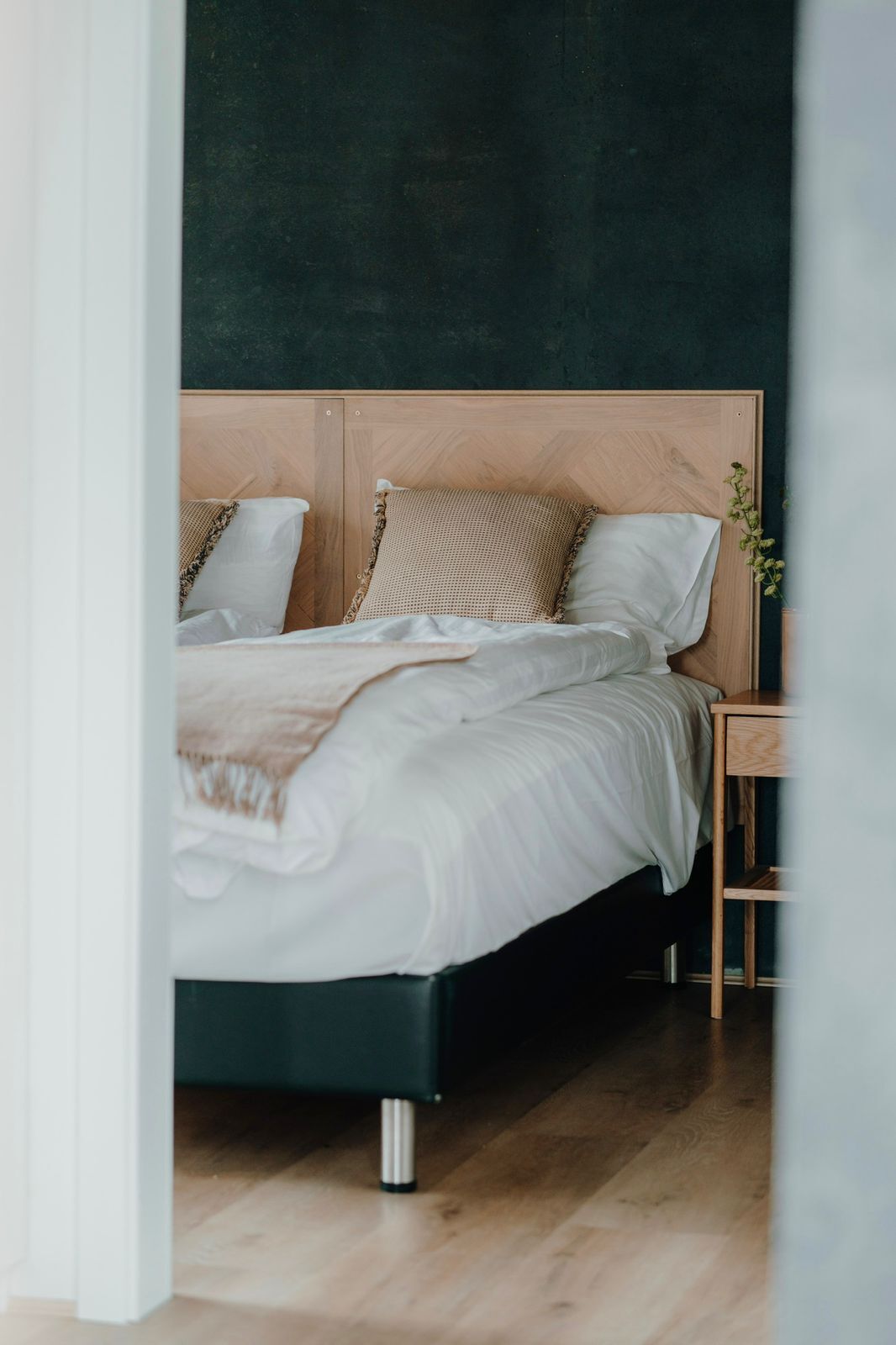 Luxury geothermal designer villa bedroom in Reykjavik with modern decor and high-end finishes.