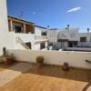 Bright outdoor terrace of a spacious 2-story townhouse for sale. Perfect for relaxing and entertaini.