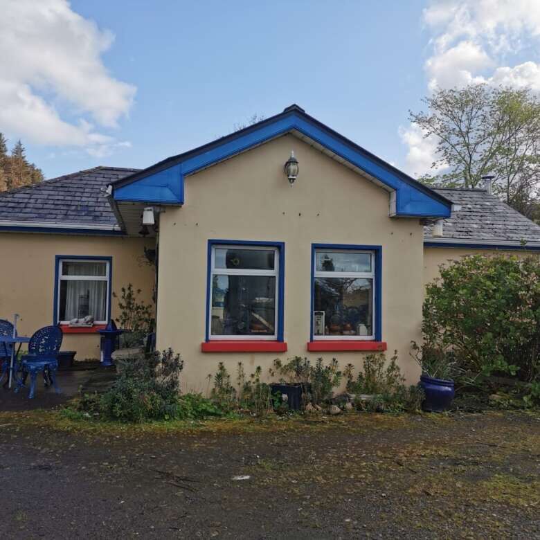 Charming home for sale in Cloonagh, County Sligo, featuring a cozy exterior and lush garden.