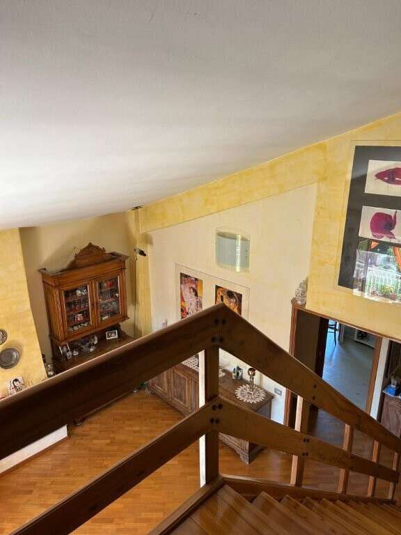 Luxury 2-bedroom penthouse apartment for sale in Ariccia, Rome, with spacious living areas and moder.