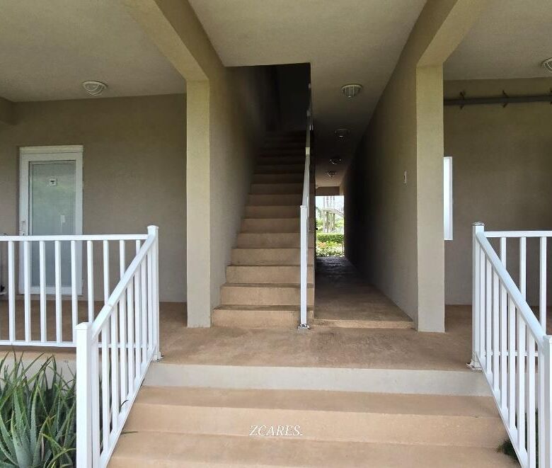Interior view of a 1-bedroom villa at Imperial Bay Residences with stairs and balcony.