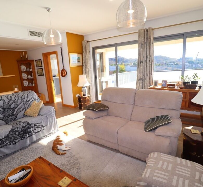 Elegant living room with large windows and scenic views in Aledo Murcia.
